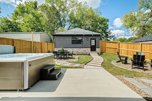 Our backyard is second to none. Equipped with a hot tub spa, Solo Stove fire pit, gas-powered grill, outdoor dining, and string lights. Plenty of space to entertain your crew!