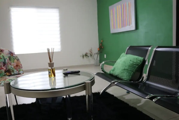 Bright sunny living room right in the middle of Playa Del Carmen