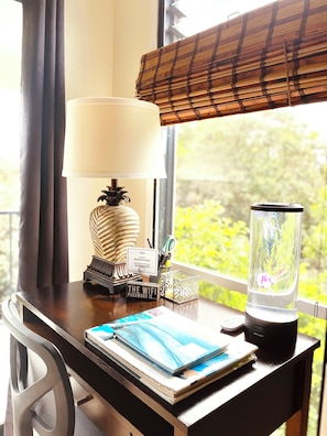 Office desk and workspace, brightly lit with natural light.