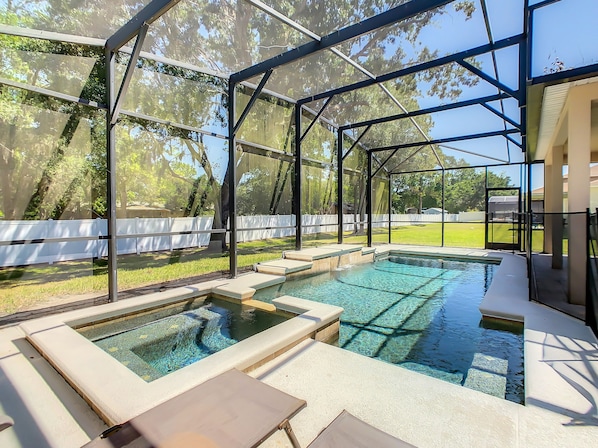 Screened back yard with Pool and Spa