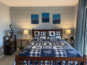 Downstairs master bedroom with a queen size bed. 