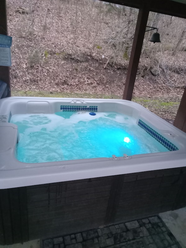 The hot tub is conveniently located on the carport. 