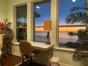 Tropical feel in the primary bedroom and a desk with a view if you need to work