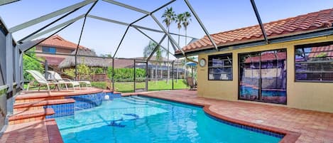 Take a dip in the screened-in, private pool, or sunbathe the day away!