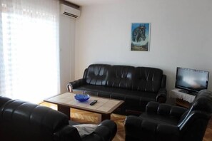 living room with kitchen and dining room