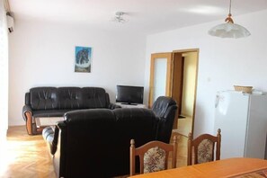 living room with kitchen and dining room