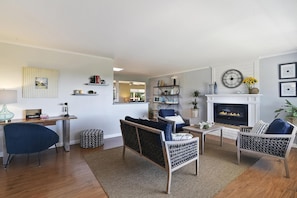 Living room with electric fireplace. Great for gathering.