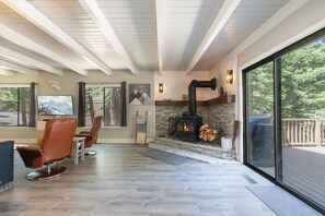 Alternate view of the living area with wood stove