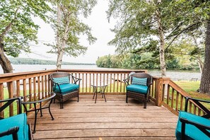 Relax and enjoy beautiful lake views from the private deck at Cozy Keyes Cottage. With comfortable seating, it’s the perfect spot for unwinding while watching the peaceful waters of Cobbosseecontee Lake.
