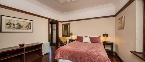 The spacious bedroom has access to the gated terrace.