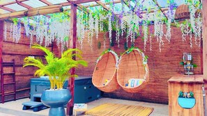 Hot Tub with hanging egg chairs with mini bar