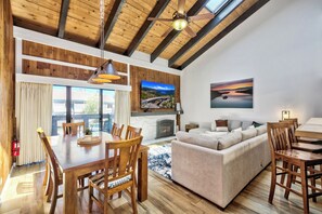 Vaulted ceilings in the living room help the space feel open and alive