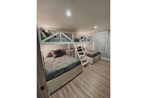 Custom designed guest room with 2 full sized beds and 2 twin beds.  Kids dream!