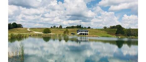 Fishing/Boating Oasis on private gated 23 acre farm.  Custom built luxury cabin