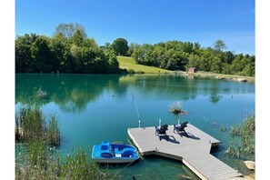 Private 3 acre fishing pond with a Trex dock and boats