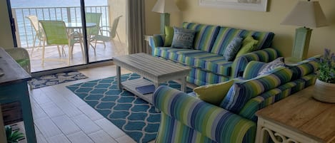 Bright and beachy open living area - couch is queen pullout