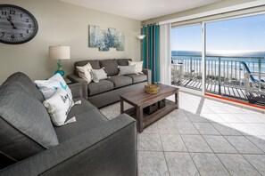 Living Room - Just steps away from your private balcony!