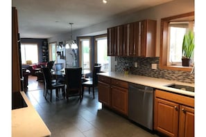 Kitchen, dining room, living room open area.