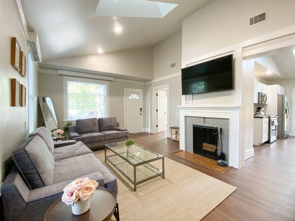 Living room with tv and fireplace