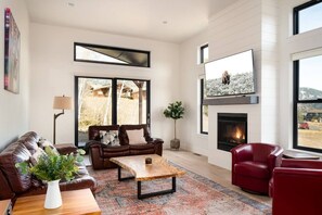 Living room with patio door to back patio and hot tub