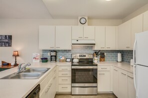 The kitchen has all the necessary amenities.