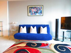 FULL-SIZE FUTON IN THE LIVING ROOM IS PERFECT FOR AN EXTRA OVERNIGHT GUEST