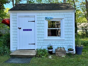 beach shed with chairs, beach tools and lots more