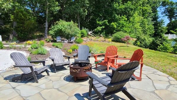 Wonderful bluestone patio with Adirondack chairs and firepit