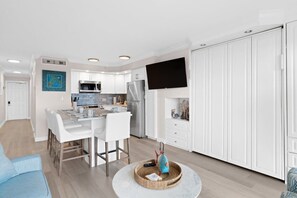 55" smart TV conveniently located between the dining and living area