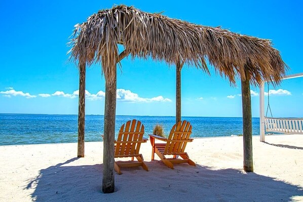 Enjoy the private beach exclusive to the resort with plenty of seating and things to do on the property...or an easy walk, driver, or Uber to near by bars and restaurants. All of that is only 10 minutes from the Airport.