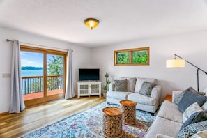 Cozy main-level living room with access to the deck.