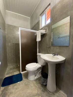 Spacious bathroom made with polished cement