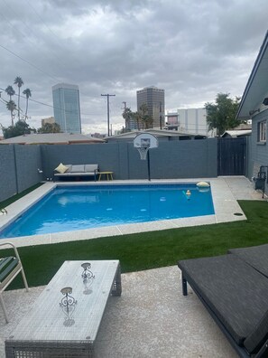 City VIEWS and remodeled pool area with synthetic turf