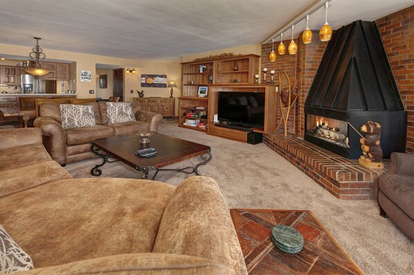 Living area with smart TV and gas fireplace.