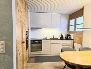 Flooring, Interior Design, Furniture, Wood, Kitchen, Floor, Countertop, Ceiling, Cabinetry, Sink