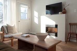 Enjoy your favourite Netflix show & staying cozy by the the electric fireplace.