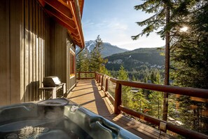 Enjoy the outdoor hot tub on the deck