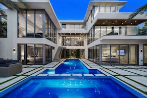 Three story modern estate with rooftop deck mansion in Las Olas Isles.