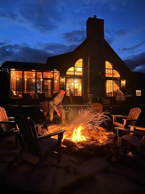 Fire pit at the back of the house that overlooks Newfound Lake.  