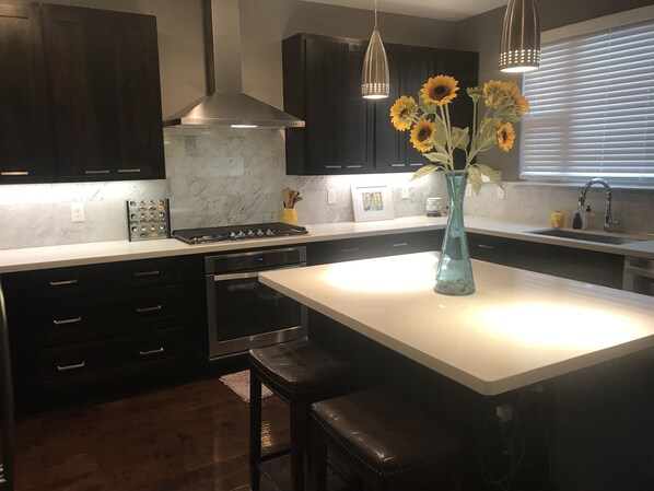Nice marble backsplash with Cortz counter top 