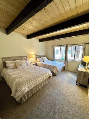 Front room with 2 queen beds and Smart TV.