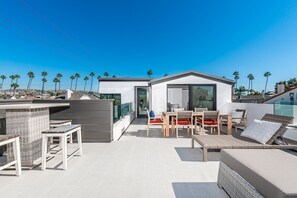 Enjoy the nightly sunsets from the rooftop deck.
                
