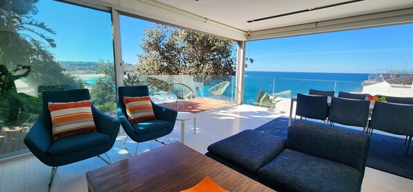 Living room with TV and balcony. Incredible views.