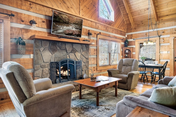 Living room with fireplace, reclining furniture