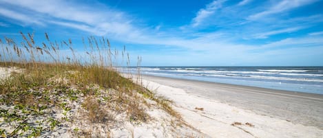 Step out across the boardwalk to this beautiful beach!