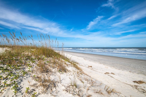 Step out across the boardwalk to this beautiful beach!