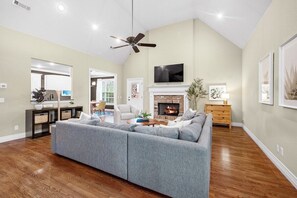 Wander into our oversized living room complete with Smart TV, working gas fireplace, and access to our fenced in backyard.