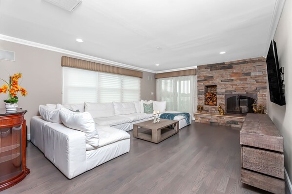 family room with fireplace and entrance to putting green 