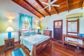 This is the master bedroom with queen bed & real wood flooring