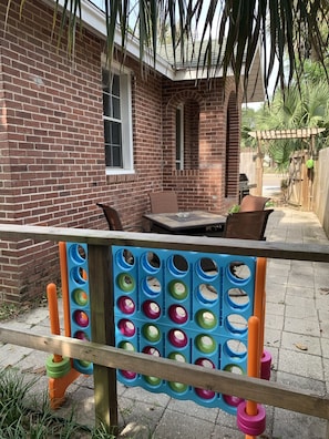 Outside patio space, huge connect 4, bbq grill and seating 